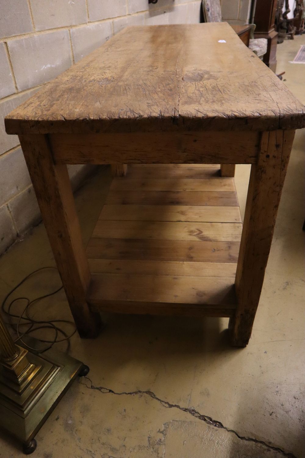 A Victorian beech and pine two tier kitchen table, width 183cm depth 65cm height 87cm